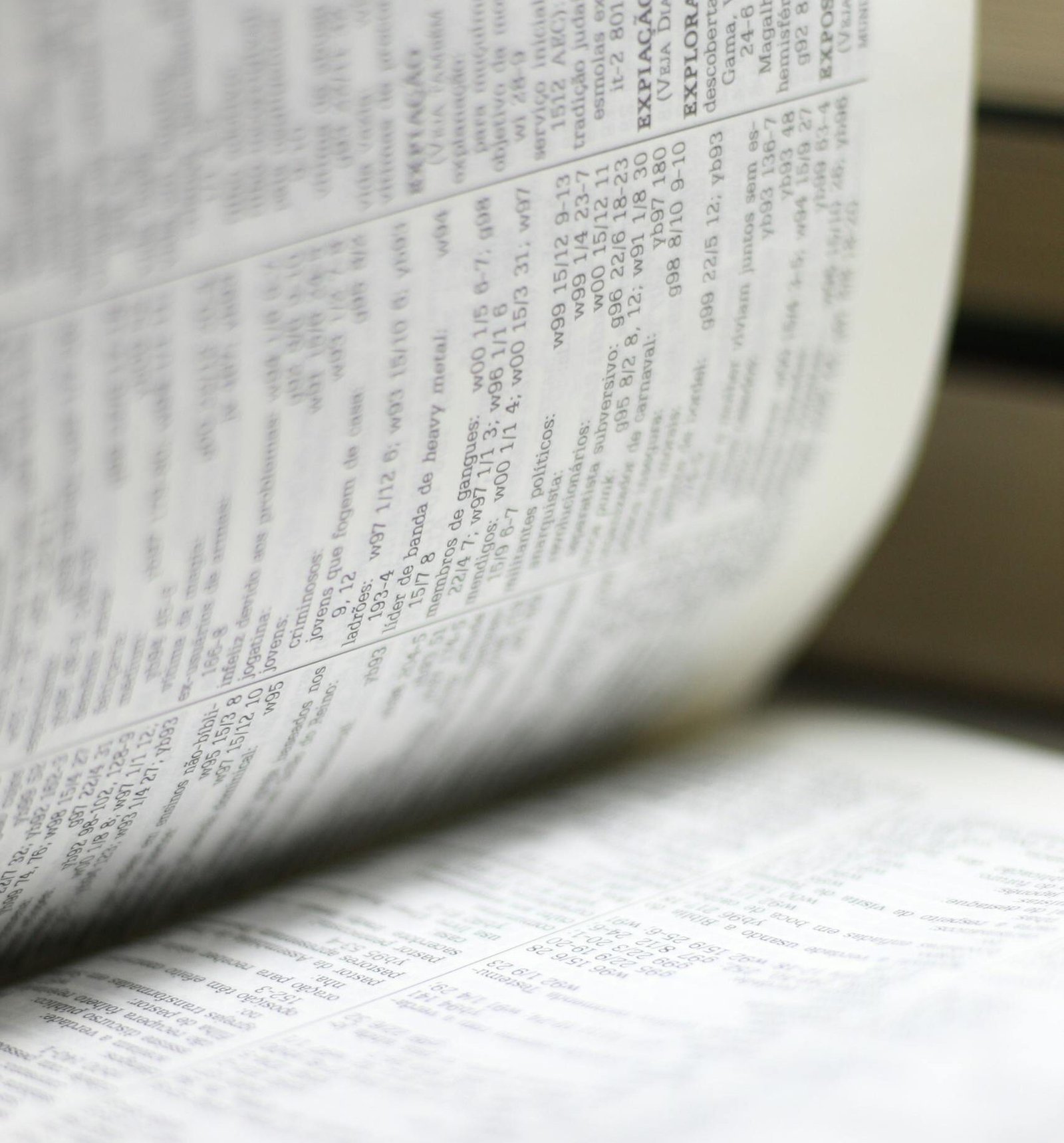 Close-up shot of an open book page, highlighting text details for educational themes.